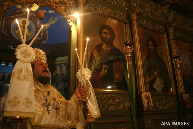 Palestinian Christian Orthodox worshippers celebrate a Palm Sunday mass in Gaza City on April 12, 2009. As Western Christians mark marked Easter Sunday, Orthodox churches were celebrating Palm Sunday, a week ahead of the...