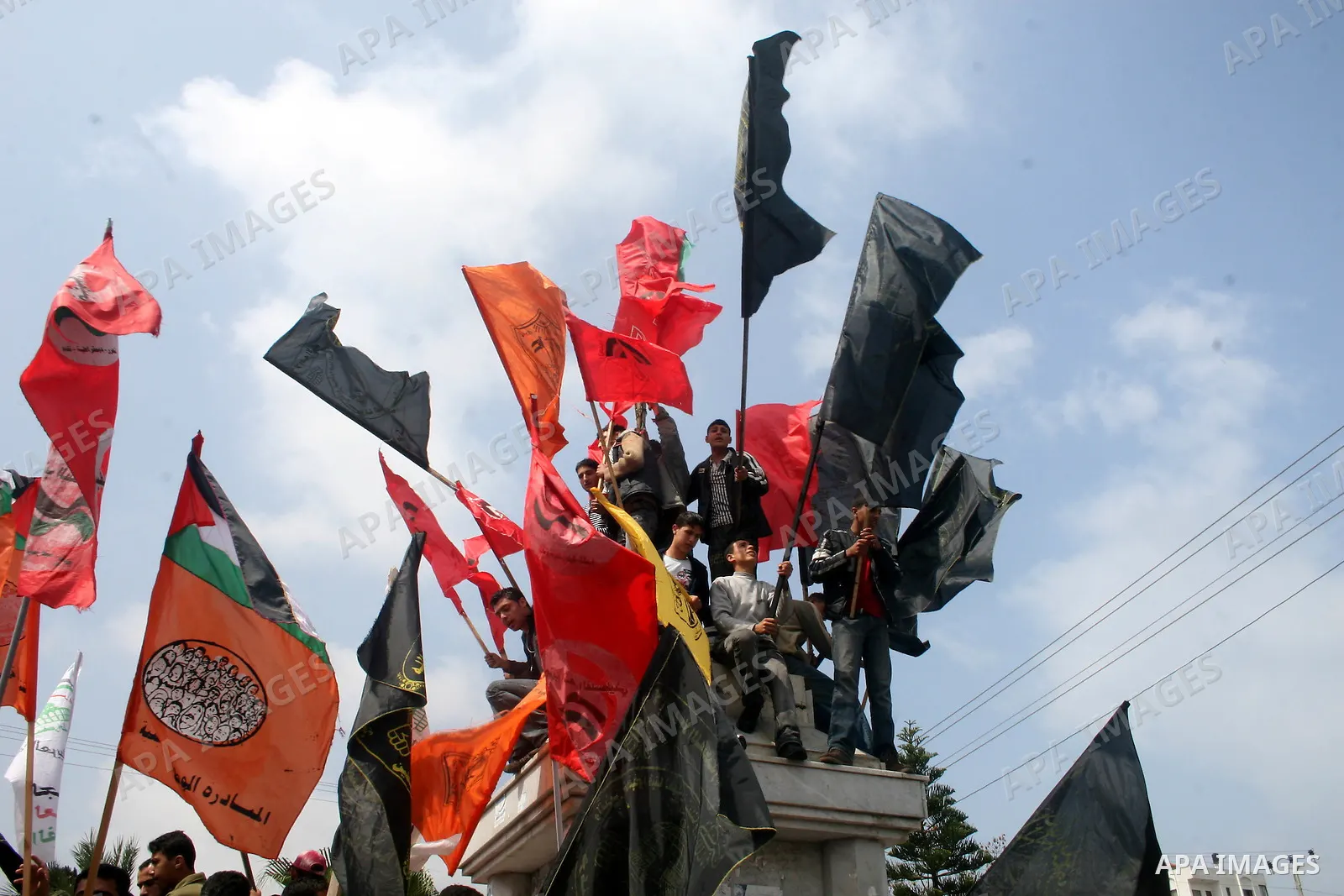 Palestinians wave flags during a rally calling for the release of Palestinian prisoners from Israeli jails in Gaza City on April 16, 2009 ahead of the Palestinian Prisoner Day. On March 17 Palestinians mark Prisoner Day,...