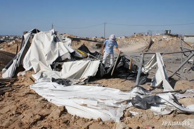 A Palestinian man inspects a tunnel destroyed by an Israeli air strike in the southern Gaza Strip May 1, 2009. Israeli aircraft destroyed four smuggling tunnels under the border between the Gaza Strip and Egypt on Friday...