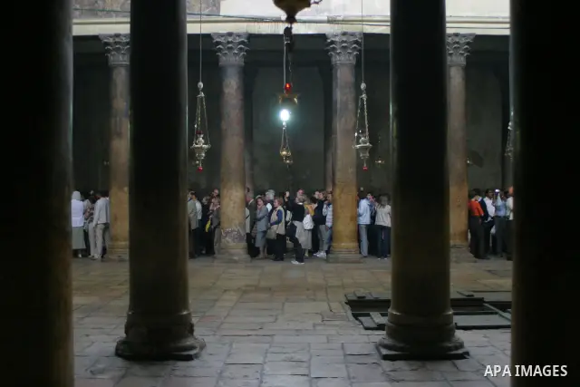 Christian pilgrims visit the Church of the Nativity, traditionally believed to be the birthplace of Jesus Christ, in the West Bank city of Bethlehem, 10 May 2009. Pope Benedict XVI on Sunday urged Middle East Christians...