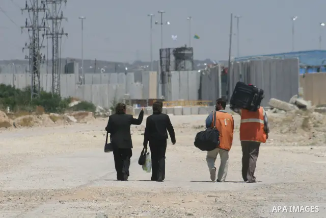 Palestinian Christians walk towards Erez crossing in the northern Gaza Strip on May 11, 2009 after Israel granted 95 permits for Christians from the isolated and impoverished territory to travel to the West Bank town of...