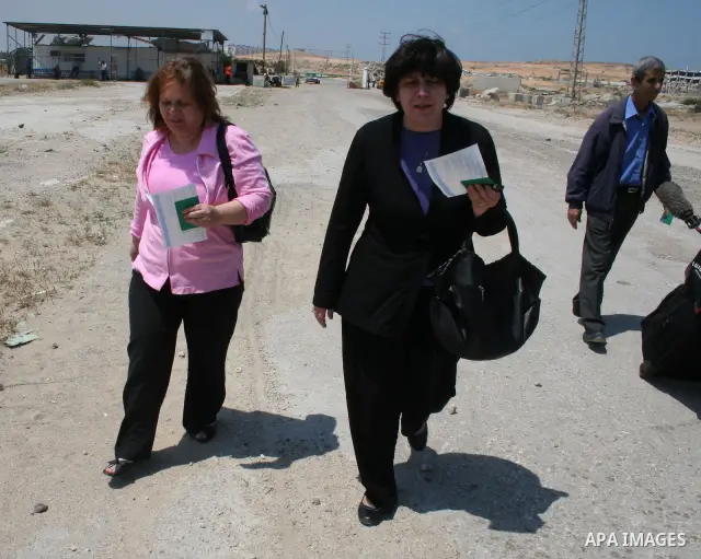 Palestinian Christians walk towards Erez crossing in the northern Gaza Strip on May 11, 2009 after Israel granted 95 permits for Christians from the isolated and impoverished territory to travel to the West Bank town of...
