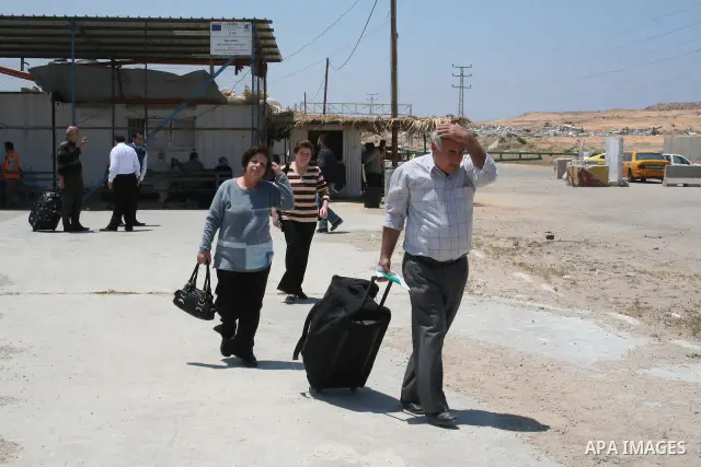 Palestinian Christians walk towards Erez crossing in the northern Gaza Strip on May 11, 2009 after Israel granted 95 permits for Christians from the isolated and impoverished territory to travel to the West Bank town of...