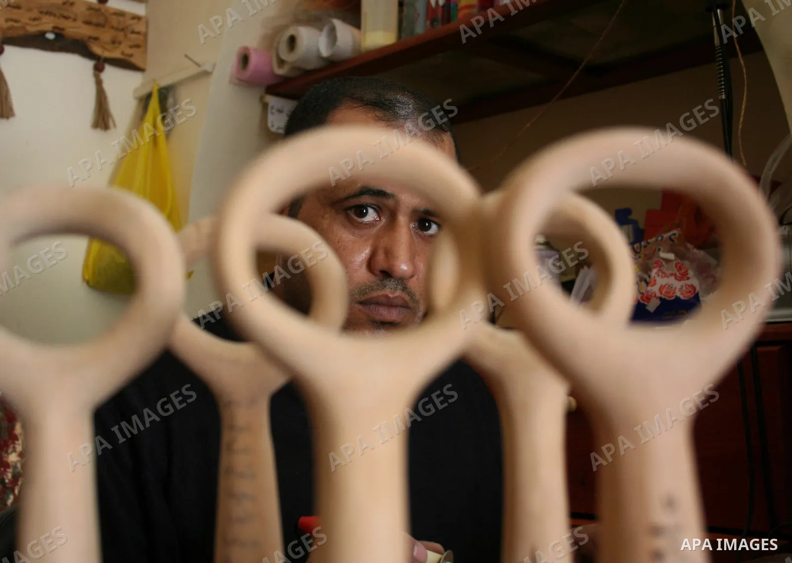 A Palestinian souvenirs maker makes a wooden key with the names of the villages and cities of the old Palestine at his shop in Gaza city, May 13, 2009. On Thursday, the Palestinians will mark their Nakba day, or the cata...