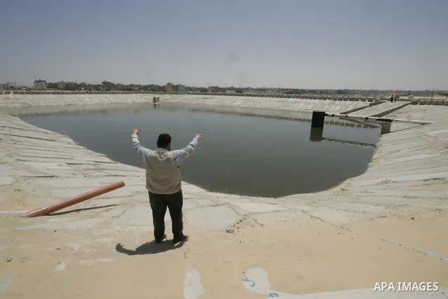 A Palestinian man stands a the Rafah water waste treatment plant which has been upgraded by the International Committee of the Red Cross (ICRC) in the southern Gaza Strip on May, 13, 2009. The International Committee of...