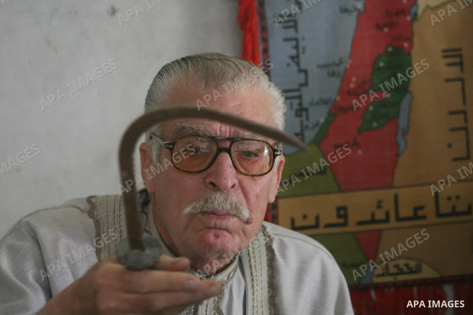 An elderly palestinian refugee Abu Marwan El-Khaldi ,80,displays his lost house ownership documents and his home Key inside 48 lands, in Gaza City. Palestinian refugees still dream to come back to their houses inside the...