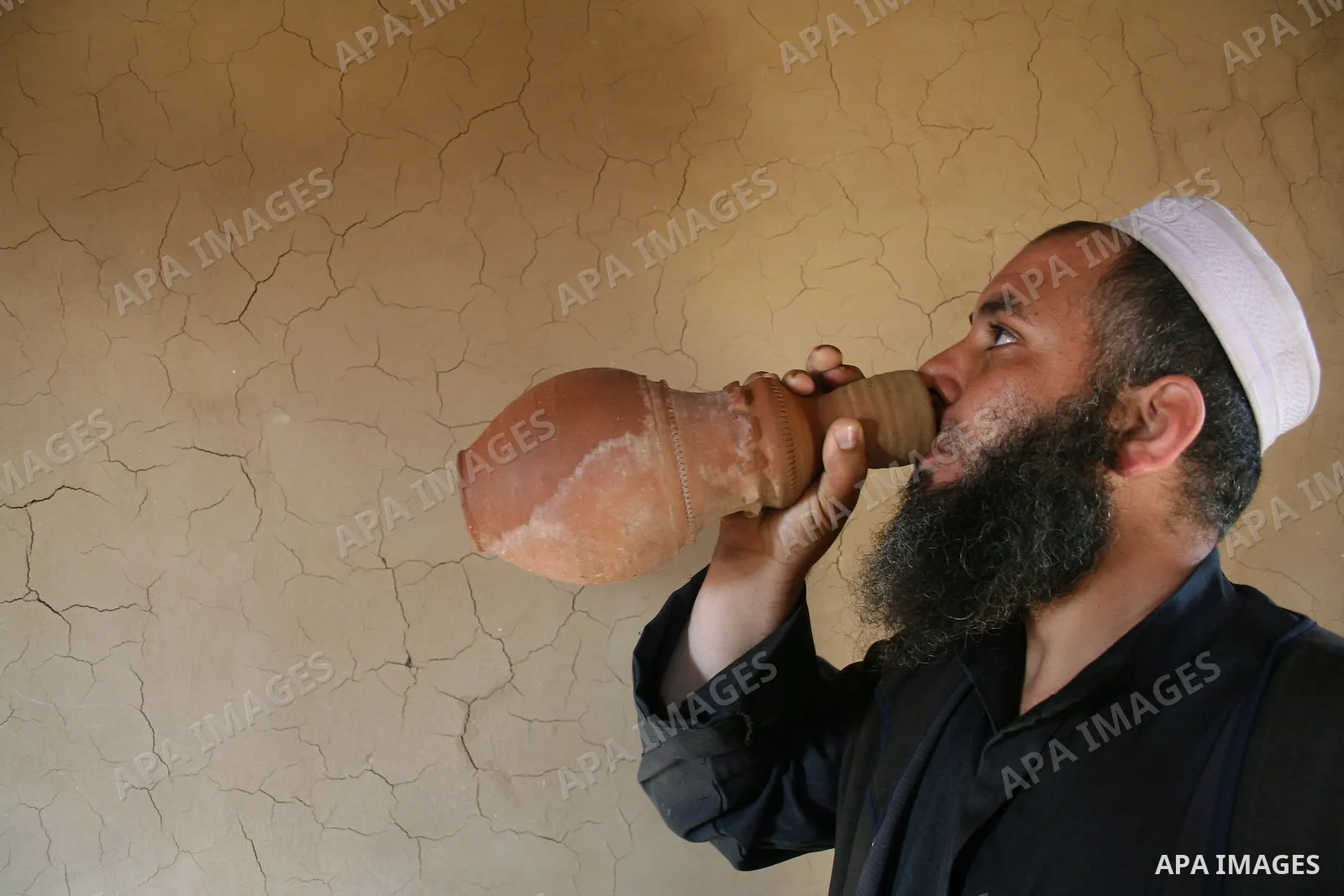 Palestinian Jihad al-Shaer, whose family home was destroyed during the last Israeli war on Gaza, stand in his new mud house in the southern Gaza Strip refugee camp of Rafah on May 24, 2009. the new mud house of jihad al-...