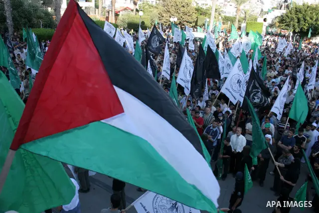 Palestinian supporters of the Islamic movement Hamas participate a rally in Gaza City, Sunday, May 31, 2009. Palestinian forces stormed a Hamas hideout in the northern West Bank, setting off a fierce battle that left six...