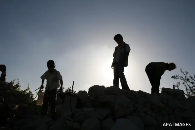 Palestinian children from al-Samoni family play atop the rubble of their house that was destroyed during Israel's offensive in the Gaza Strip earlier this year, in al-Zaitoun neighbourhood of Gaza City on June 2, 2009. T...