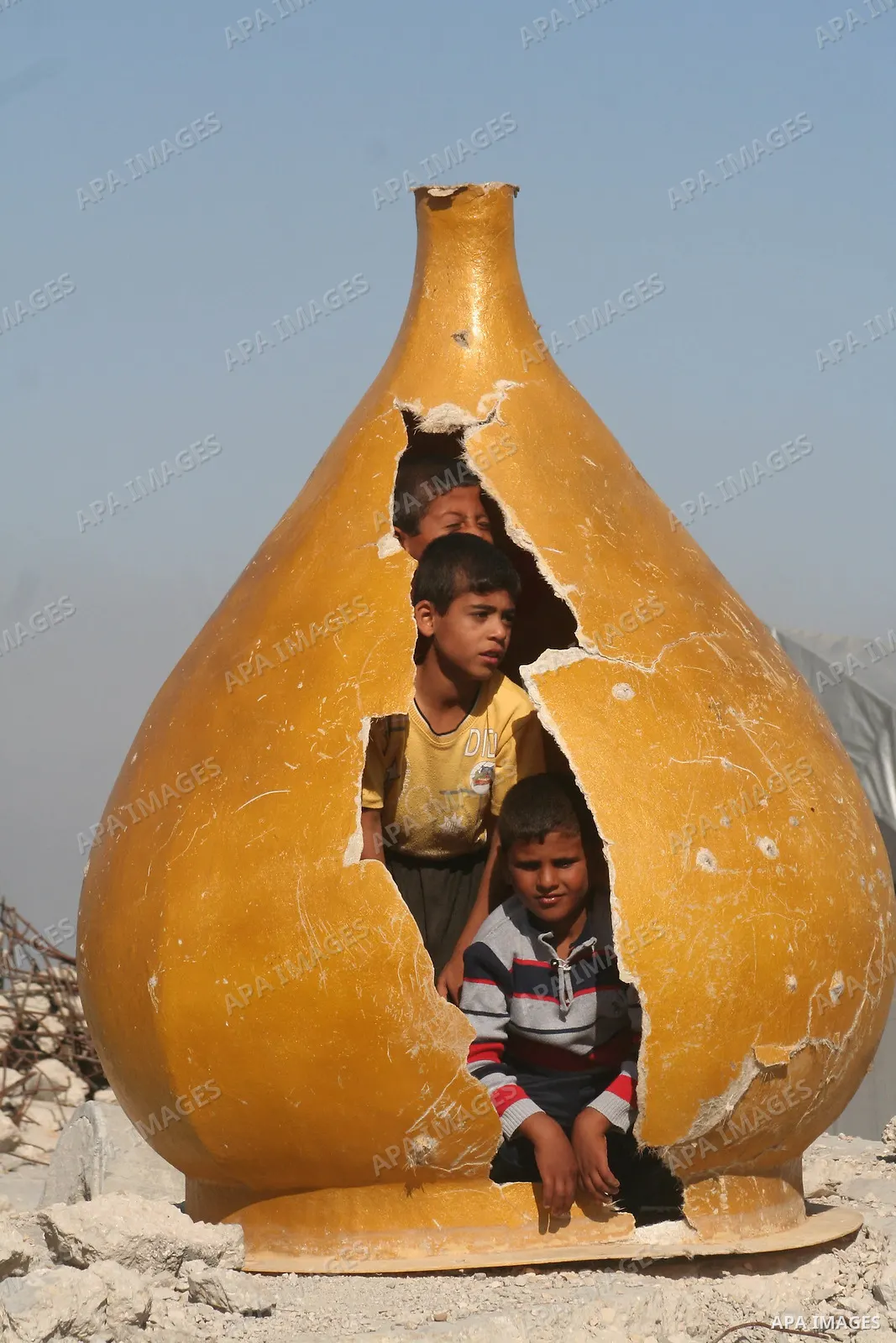 A Palestinian child plays in the rubble of a mosque as UN lead investigator Richard Goldstone and members of his delegation arrive closeby to inspect the destruction at the Samuni family home in Gaza City on June 03, 200...