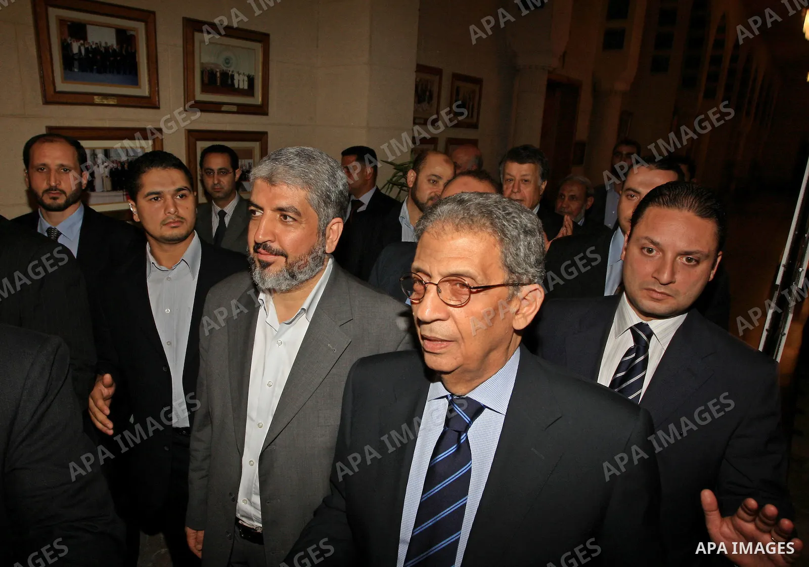 Palestinian Hamas leader Khaled Meshaal walks with Arab League Secretary General Amr Mussa to meet at the Arab League headquarters in Cairo on June 9, 2009. Meshaal is on an official visit for talks on reconciliation eff...