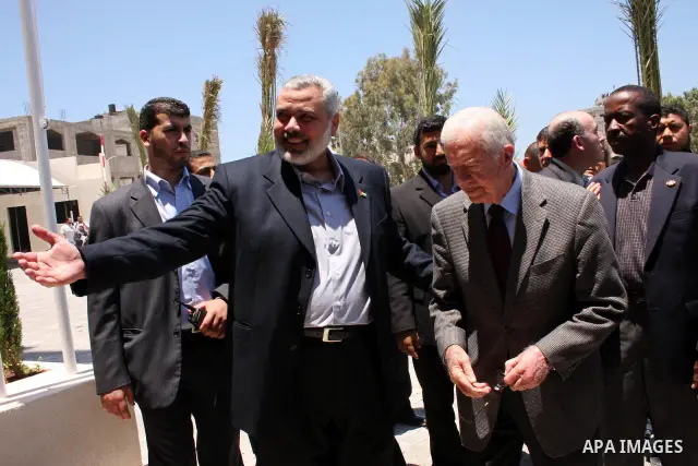 Ismail Haniya, prime minister of the Islamist Hamas movement meets with former US President Jimmy Carter in Gaza City on June 16, 2009. Carter denounced the deprivations facing Palestinians in Gaza as unique in history,...