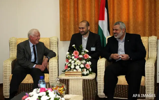 Ismail Haniya, prime minister of the Islamist Hamas movement meets with former US President Jimmy Carter in Gaza City on June 16, 2009. Carter denounced the deprivations facing Palestinians in Gaza as unique in history,...