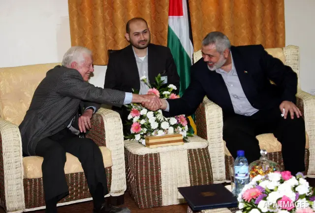 Ismail Haniya, prime minister of the Islamist Hamas movement meets with former US President Jimmy Carter in Gaza City on June 16, 2009. Carter denounced the deprivations facing Palestinians in Gaza as unique in history,...