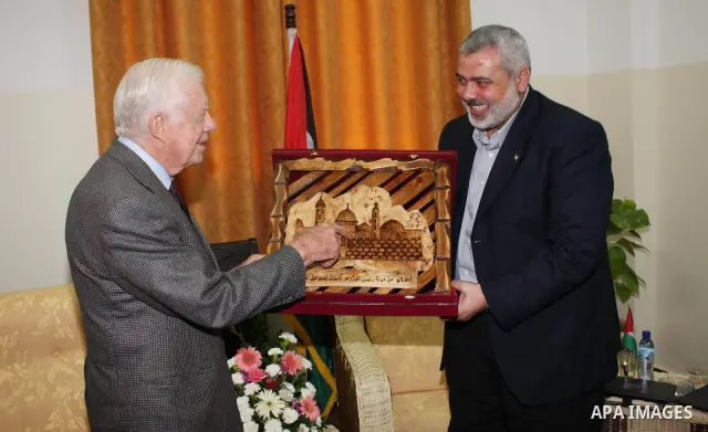 Ismail Haniya, prime minister of the Islamist Hamas movement meets with former US President Jimmy Carter in Gaza City on June 16, 2009. Carter denounced the deprivations facing Palestinians in Gaza as unique in history,...