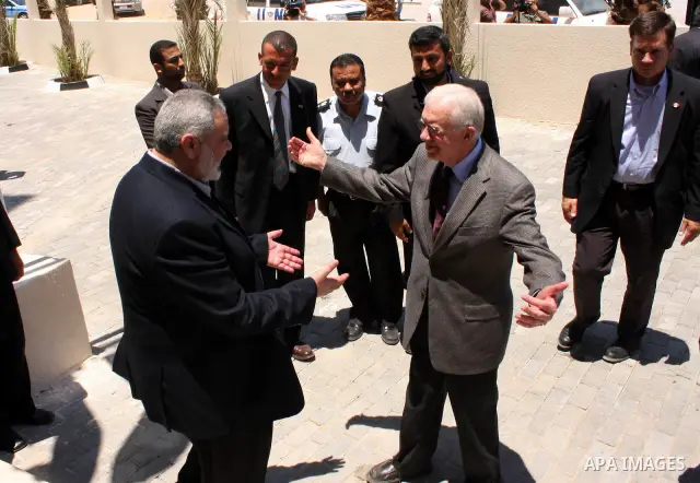 Ismail Haniya, prime minister of the Islamist Hamas movement meets with former US President Jimmy Carter in Gaza City on June 16, 2009. Carter denounced the deprivations facing Palestinians in Gaza as unique in history,...