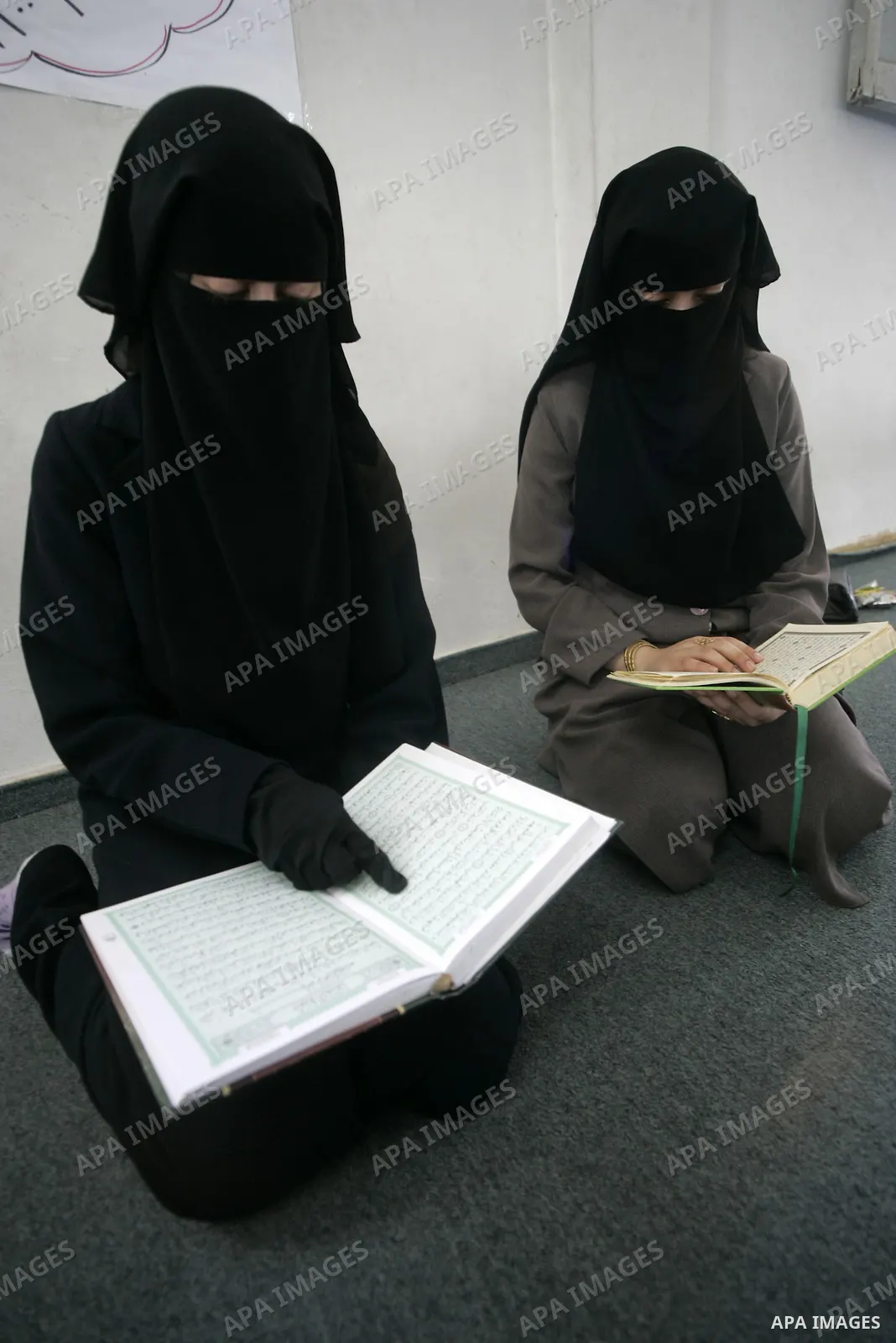 A Palestinian girls read the Koran at a mosque in Rafah, southern Gaza Strip on June 23, 2009. The Palestinian Islamist movement Hamas launched summer camps for the study of the Koran, drawing a broad participation from...