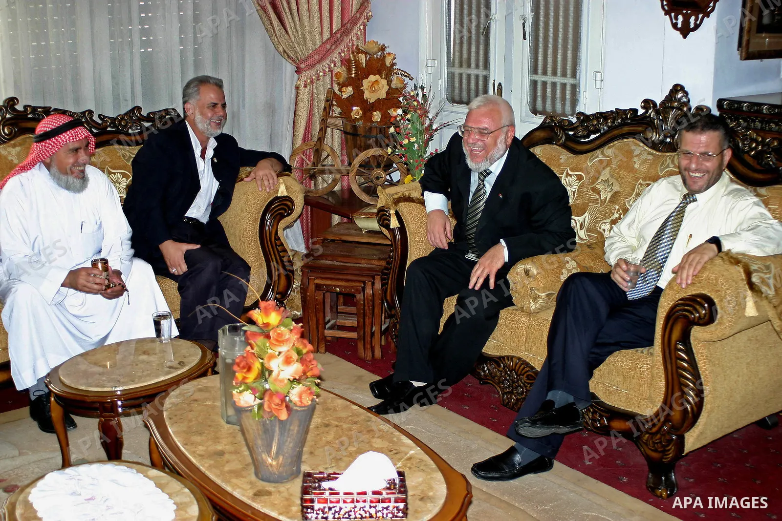 An Arab Parliament members of Israeli knesset, Ibrahim Sarsur (2L) , Soud Ghanaiem(1L) and the secretary-general of the Palestinian Legislative Council, Mahmoud Ramahi (1R), greets Aziz Dweik at Dweik's house in the West...