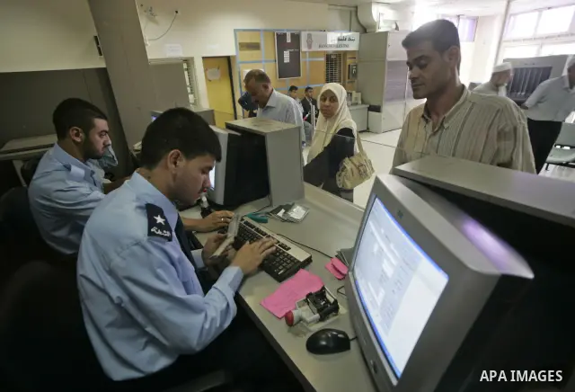 A Palestinians cross into Egypt through the Rafah border crossing which opened on Saturday for three days for Palestinians with humanitarian cases, at the Rafah border crossing in the southern Gaza Strip on June 27, 2009...