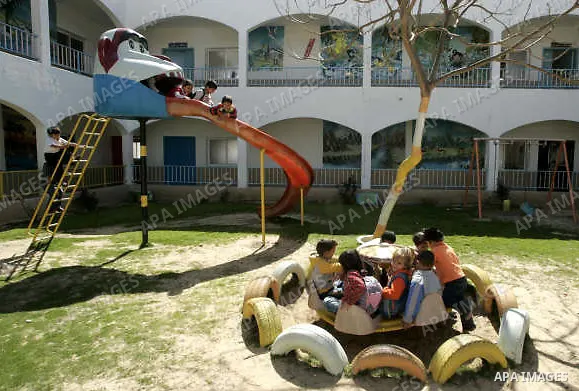 A Palestinian orphans play in the playground of the SOS Children's Village in Rafah the southern Gaza Strip on June 30, 2009. The school for orphans that was established in 2000 with the sponsorship of the Austrian SOS i...