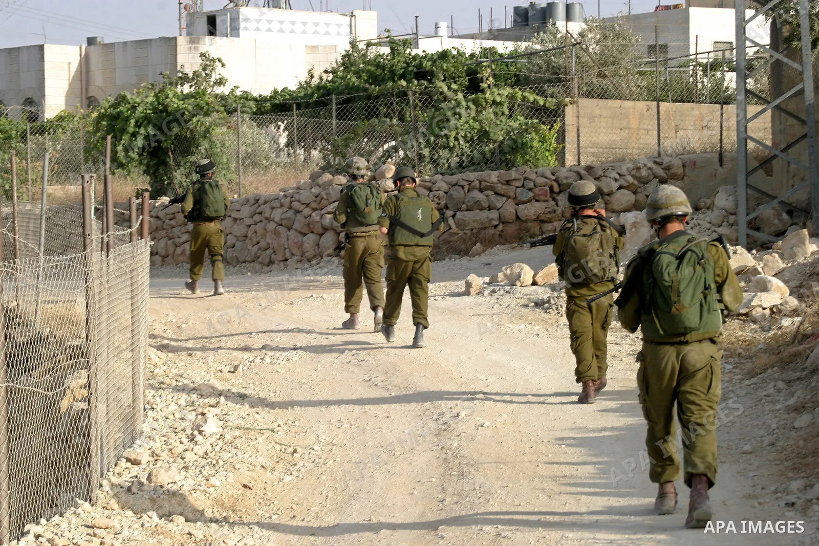 Israeli soldiers take position during a military operation in the West Bank city Hebron on July1, 2009. Photo by Najeh Hashlamoun