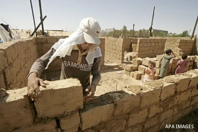 Palestinian workers prepare blocks of clay for the construction of clay houses to replace houses destroyed in Israel's last military operation in Gaza, in Rafah, southern Gaza Strip on July 02 2009. Many parts of the Ham...