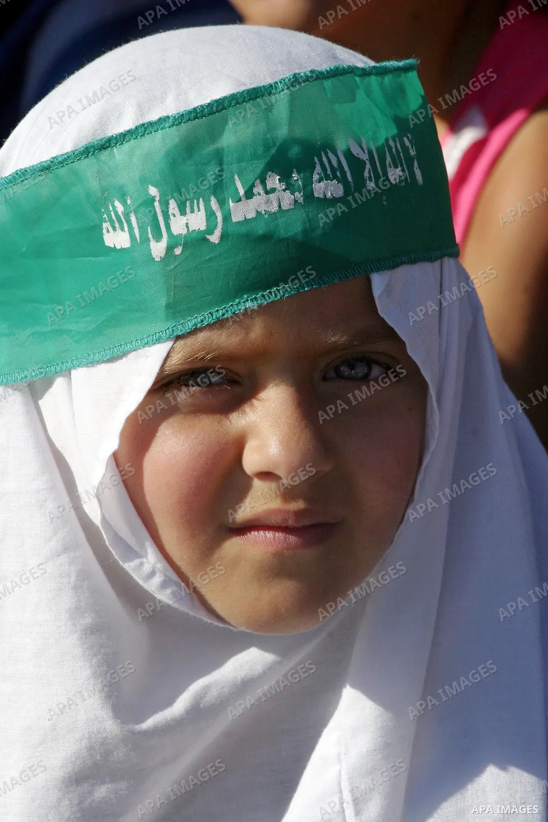 A Palestinian supporters of hamas attend a protest against the demolishing of Palestinian houses by Israeli municipality in front of the dome of the rocke at Al-Aqsa mosque in the old city of Jerusalem on July 18, 2009....