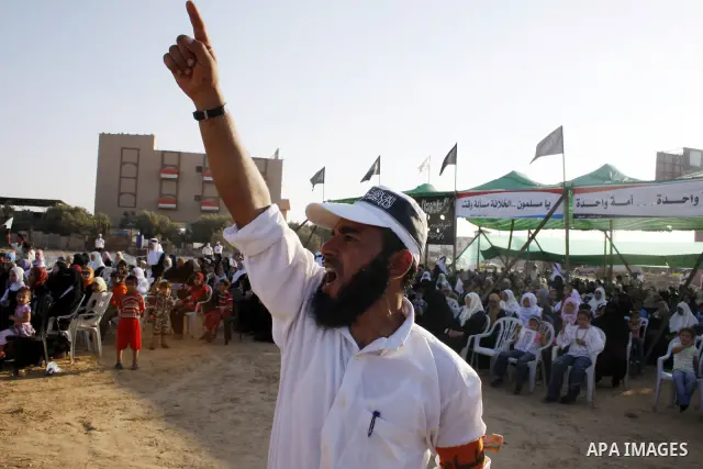 Palestinian supporters of Al-Tahrir Party, an international pan-Islamist party seeking to re-establish an international Islamic state, attend a rally in Bureij refugee camp, central Gaza Strip, Monday, July 20, 2009. Al-...