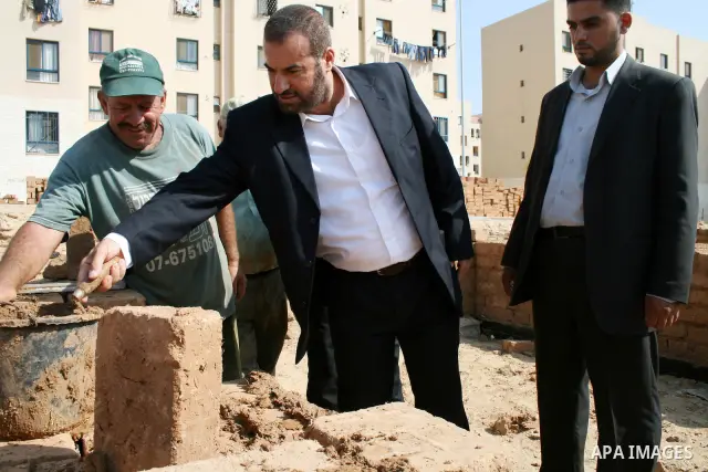 Palestinian Interior minister Fathi Hamad puts a stone of clay to establish a new police station in beit-lahia town northern Gaza city on July 22, 2009. Photo by STR