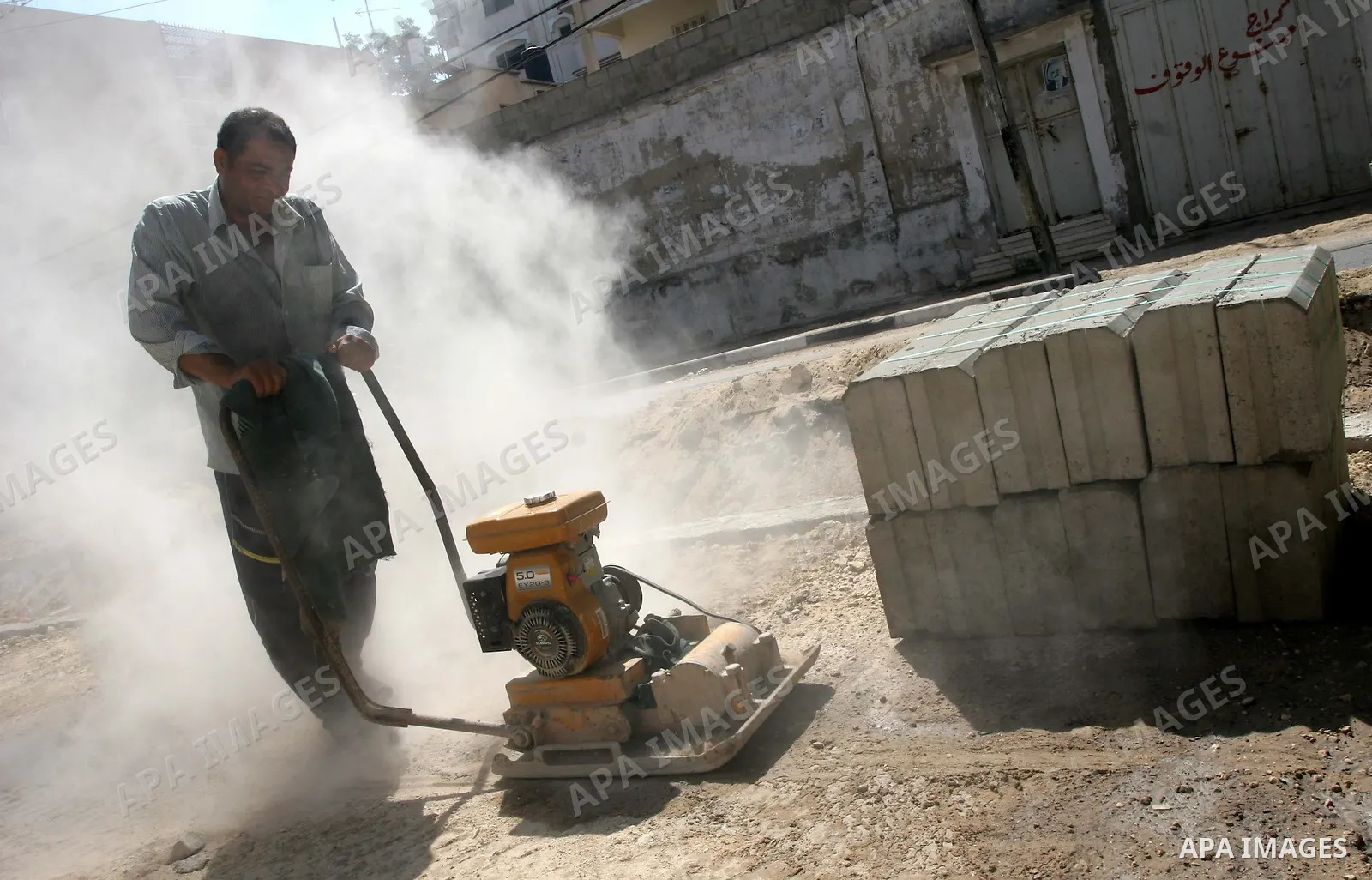 A Palestinian workers renovate El-Nasr Street in Gaza City on July 28, 2009. Photo By Mohammed Asad