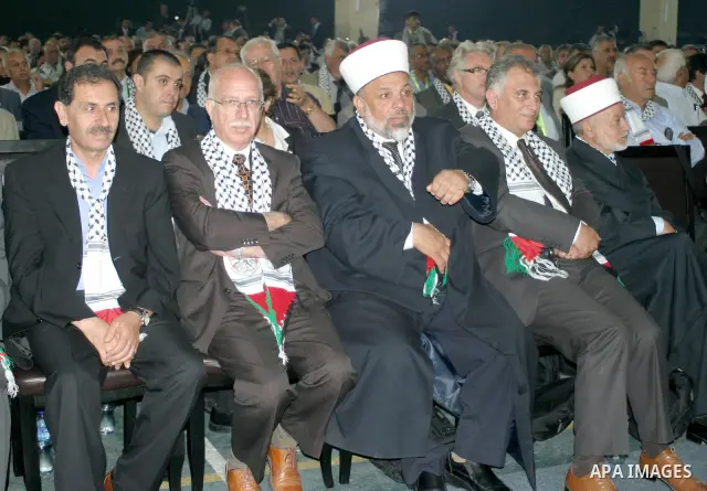 Members of Fatah listen to speeches during the Fatah conference in the West Bank town of Bethlehem, Tuesday, Aug. 4, 2009. The Palestinians' Fatah movement came together Tuesday for its first convention in 20 years, tryi...