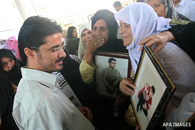 The freed Jordanian from Israeli Jails, Yasser Agloni attends a protest calling for release the Palestinian prisoners from Israeli Jails in Gaza City on August 10, 2009. Currently Israel is holding 11,000 Palestinians in...