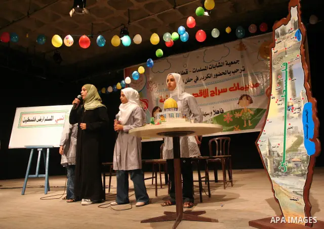 Palestinian girls perform during a summer camp in Gaza city on Aug 10, 2009. Photo By Mohammed Asad