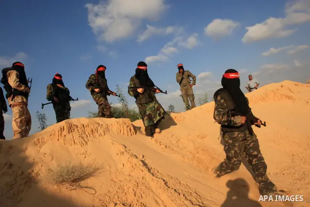 Palestinian women and male fighters from the Democratic Front for the Liberation of Palestine (DFLP), take part in a military training in Rafah southern Gaza Strip, August 10, 2009. Taking advantage of relevant calmness,...