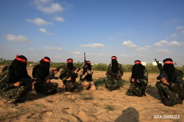 Palestinian female fighters from the Democratic Front for the Liberation of Palestine (DFLP), take part in a military training in Rafah southern Gaza Strip, August 10, 2009. Taking advantage of relevant calmness, the Pal...