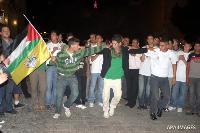Palestinians Fatah movement members wait for voting results in the West Bank town of Bethlehem, on 10 August 2009. Palestinian president Mahmud Abbas's Fatah faction was electing new leaders for the first time in 20 year...