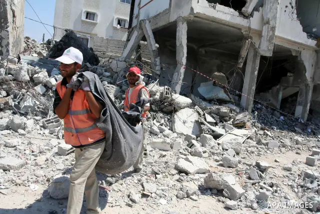 Palestinian workers remove the rubble of the security headquarters "Saraya" which destroyed during 22 days of israeli offensive, in Gaza city on August 11, 2009. Photo By Mohammed Asad