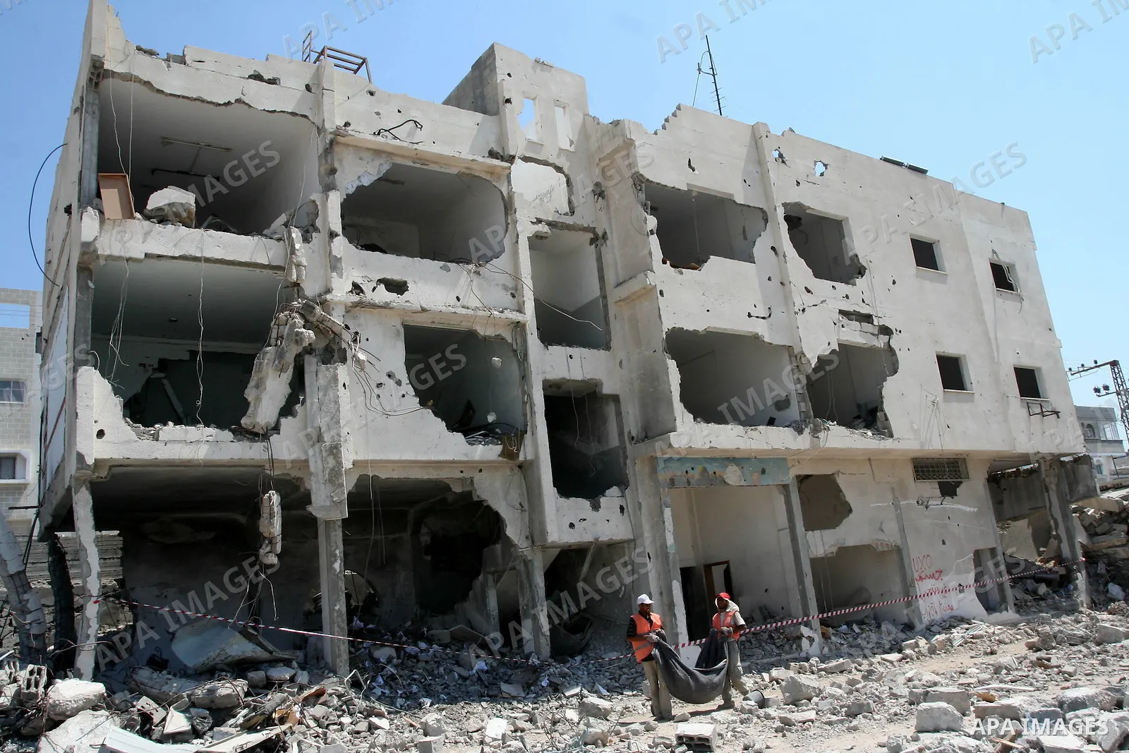 Palestinian workers remove the rubble of the security headquarters "Saraya" which destroyed during 22 days of israeli offensive, in Gaza city on August 11, 2009. Photo By Mohammed Asad
