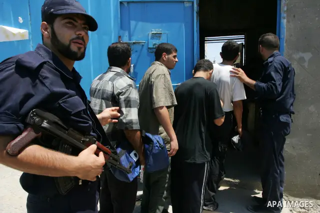 A Hamas police bring new inmates to the prison controlled by the Hamas police in Gaza City on August 11, 2009. The detention facility was opened after Gaza's main prison was destroyed during Israel's 22-day military offe...