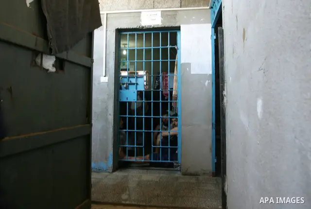 A Hamas police bring new inmates to the prison controlled by the Hamas police in Gaza City on August 11, 2009. The detention facility was opened after Gaza's main prison was destroyed during Israel's 22-day military offe...