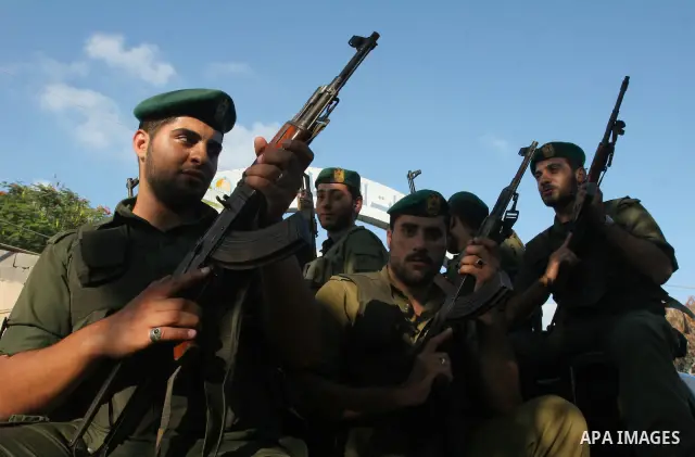 Hamas security forces during a military parade at a governmental compound that was destroyed during Israel's December-January offensive on the Gaza Strip, in Gaza City on August 13, 2009 to honour comrades who were kille...