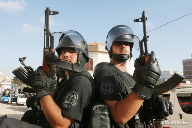 Hamas security forces during a military parade at a governmental compound that was destroyed during Israel's December-January offensive on the Gaza Strip, in Gaza City on August 13, 2009 to honour comrades who were kille...