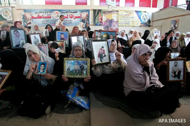 Palestinians take part in a protest in Gaza City calling for the release of Palestinian prisoners from Israeli jails August 17, 2009. Some 11,000 Palestinians are in Israeli prisons and securing their freedom is a highly...