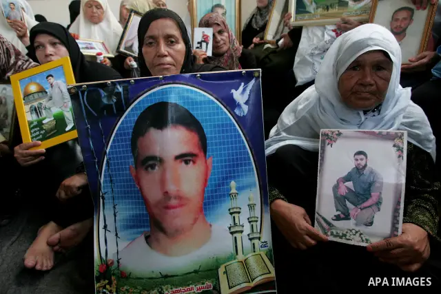 Palestinians take part in a protest in Gaza City calling for the release of Palestinian prisoners from Israeli jails August 17, 2009. Some 11,000 Palestinians are in Israeli prisons and securing their freedom is a highly...