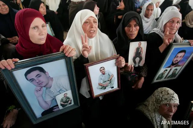 Palestinians take part in a protest in Gaza City calling for the release of Palestinian prisoners from Israeli jails August 17, 2009. Some 11,000 Palestinians are in Israeli prisons and securing their freedom is a highly...