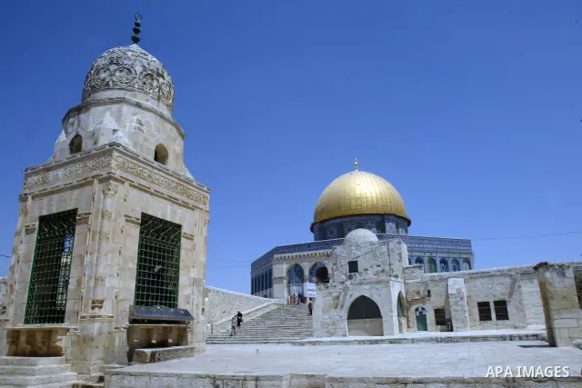 A Palestinians walks in front of the dome of the rock at Alaqsa mosque during the memorial ceremony of burning Alaqsa mosque in 1969 and one day before starting of the Islamic holyest fasting month Ramadan in the old cit...