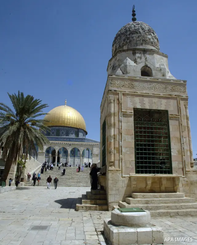 A Palestinians walks in front of the dome of the rock at Alaqsa mosque during the memorial ceremony of burning Alaqsa mosque in 1969 and one day before starting of the Islamic holyest fasting month Ramadan in the old cit...