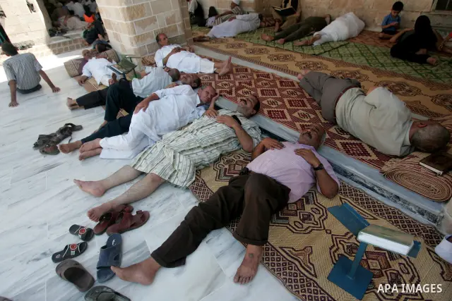 A Palestinians read the holy Koran at a mosque, on the first day of the holy fasting month Ramadan in Gaza city on August 22, 2009. The start of the ninth and holiest month of the Muslim calendar is traditionally determi...