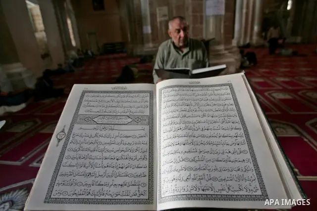 A Palestinians read the holy Koran at a mosque, on the first day of the holy fasting month Ramadan in Gaza city on August 22, 2009. The start of the ninth and holiest month of the Muslim calendar is traditionally determi...
