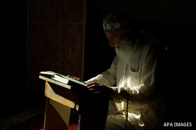 A Palestinian reads the holy Koran at a mosque on the first day of the holy fasting month Ramadan in the west Bank city of Ramallah on August 22, 2009. The start of the ninth and holiest month of the Muslim calendar is t...
